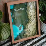 Laser engraved topical map of Ecuador in a brown frame