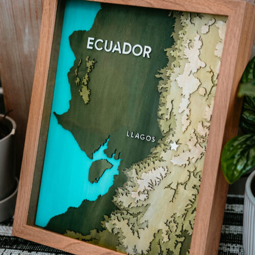 Laser engraved topical map of Ecuador in a brown frame