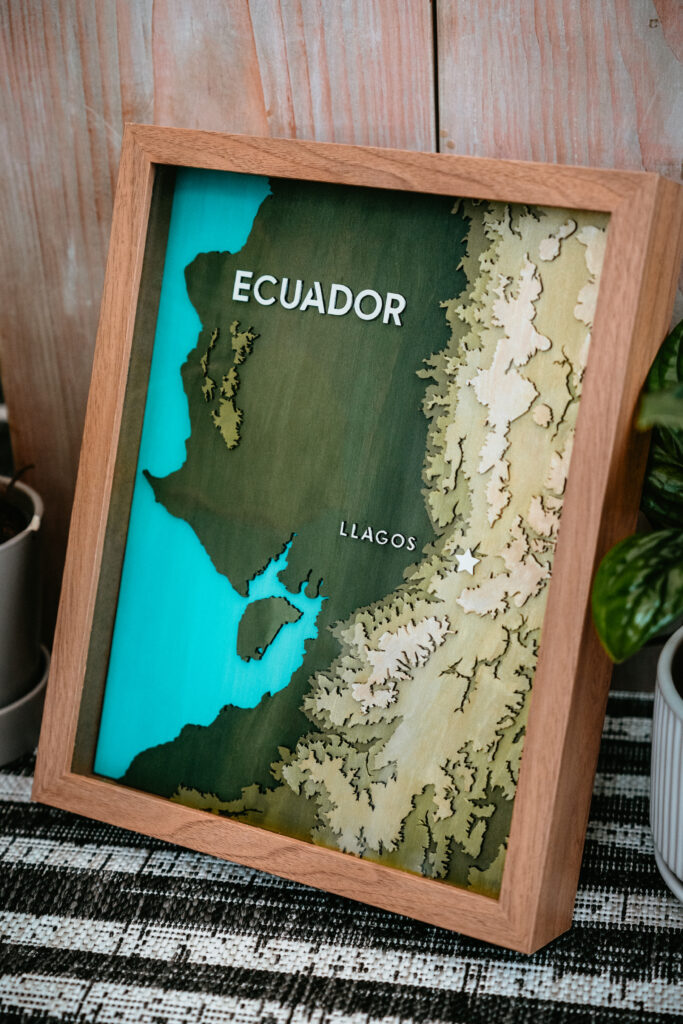 Laser engraved topical map of Ecuador in a brown frame