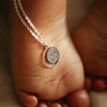 Silver laser engraved footprint pendant