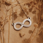 Silver laser engraved infinity pendant