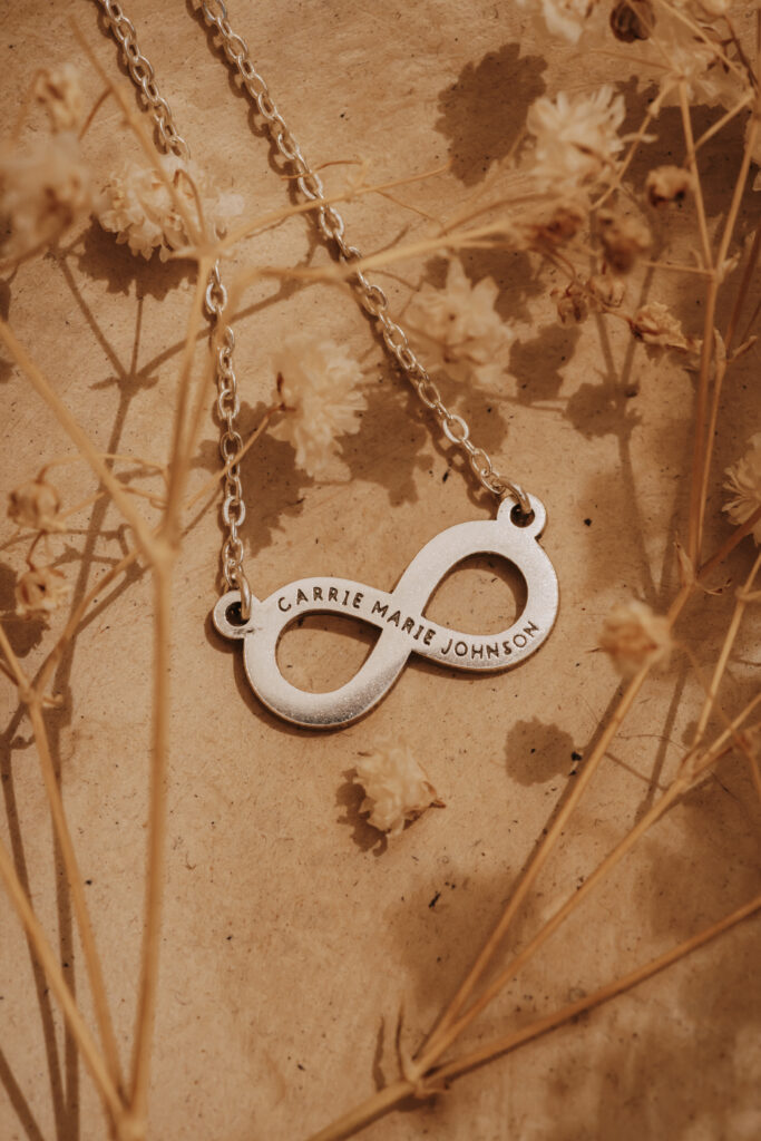 Silver laser engraved infinity pendant