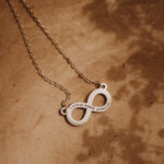 Silver laser engraved infinity pendant