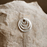 Silver laser engraved stacked circle pendant