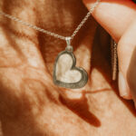 Silver heart shaped breastmilk filled pendants