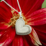 Silver heart shaped breastmilk filled pendant