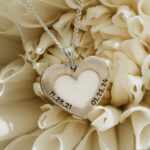 Silver heart shaped breastmilk filled pendant