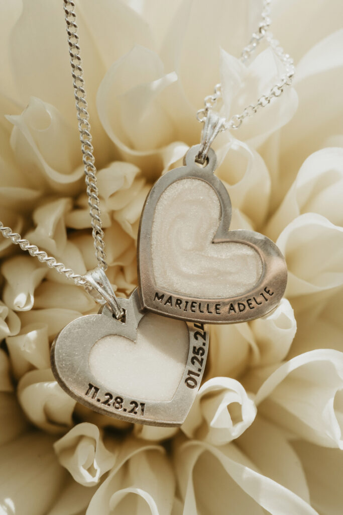 Silver heart shaped breastmilk filled pendants