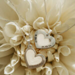 Silver heart shaped breastmilk filled pendants