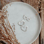 Silver infinity and heart shaped pendants