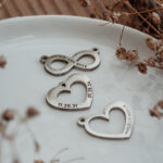 Silver infinity and heart shaped pendants