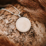 Silver breastmilk filled circle pendant