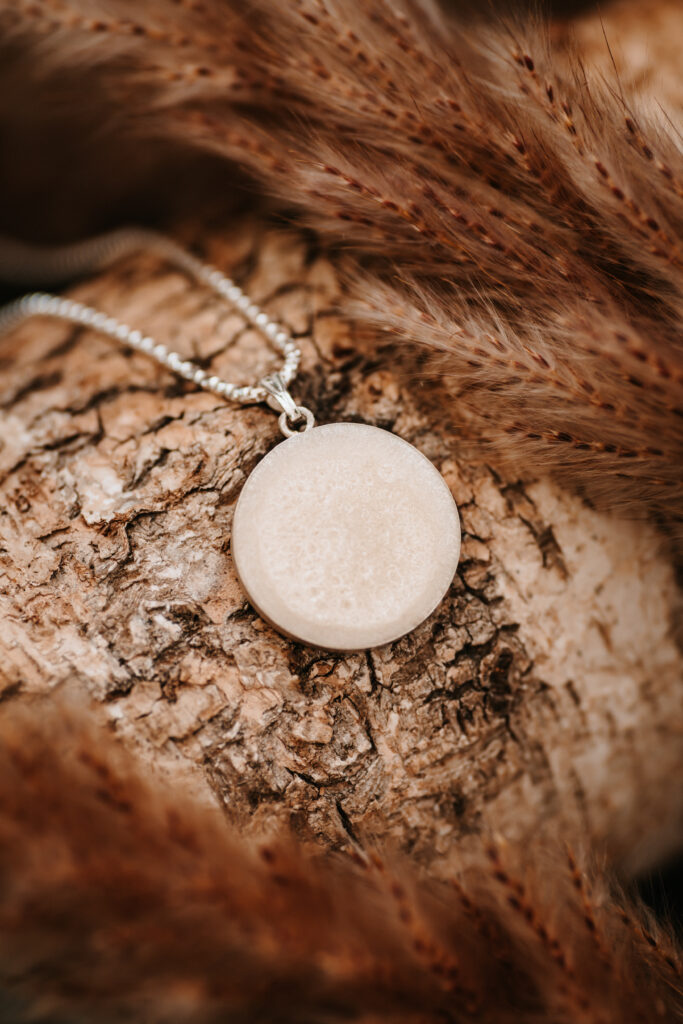 Silver breastmilk filled circle pendant