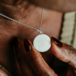 Silver breastmilk filled circle pendant