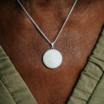 Silver breastmilk filled circle pendant