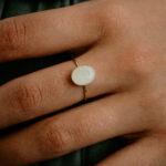 Gold oval breastmilk filled ring