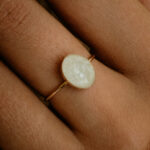 Gold oval breastmilk filled ring