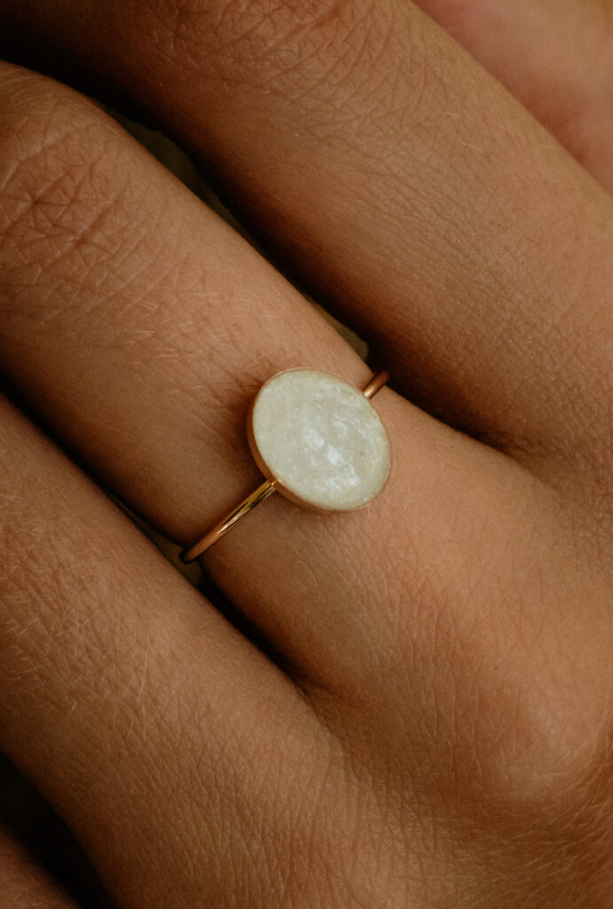 Gold oval breastmilk filled ring