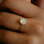 Gold breastmilk filled ring with gold flakes