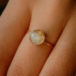 Gold breastmilk filled ring with gold flakes