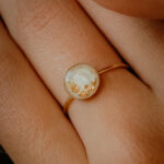 Gold breastmilk filled ring with gold flakes