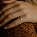 Gold oval breastmilk filled ring