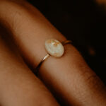 Gold oval breastmilk filled ring