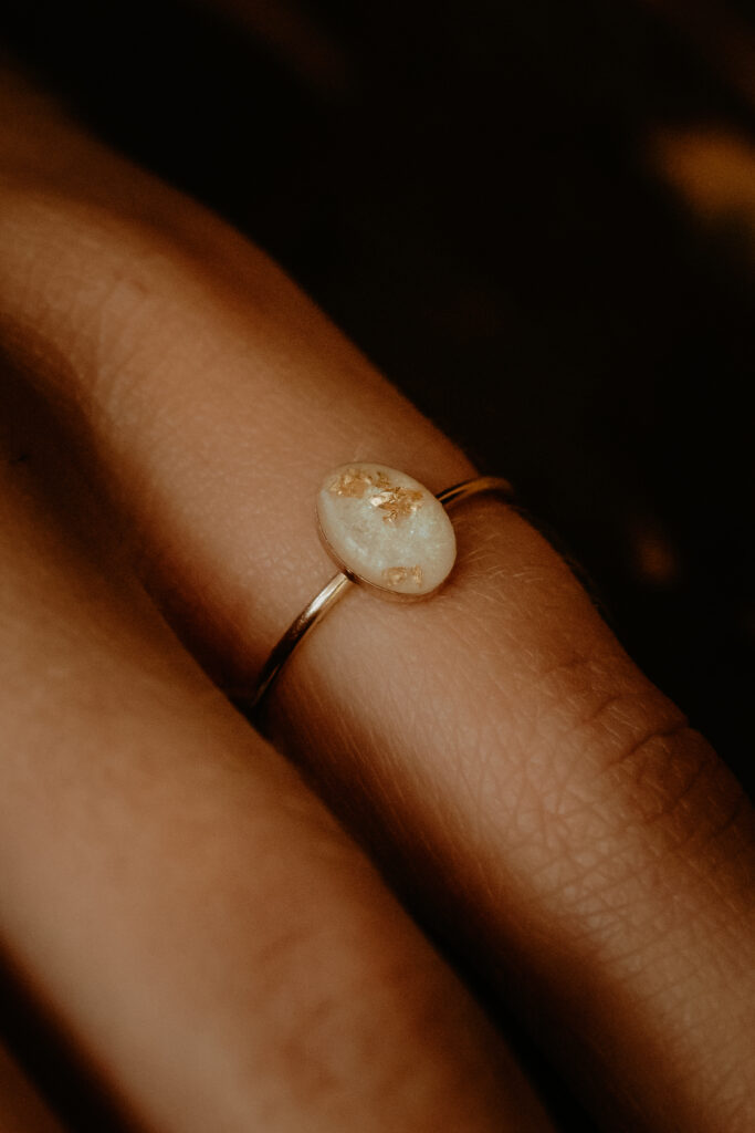 Gold oval breastmilk filled ring