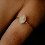 Gold oval breastmilk filled ring