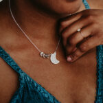 Woman wearing silver laser engraved breastmilk necklace