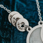 Silver laser engraved breastmilk necklace with engraved rings