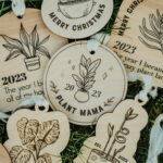 Wooden Christmas ornaments with laser engraved plants