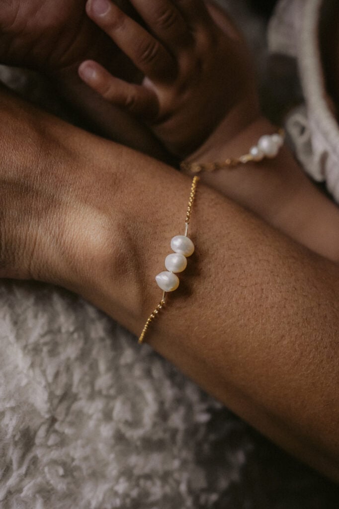 Close-up of pearl bracelet and necklace from NYMAR Designs.